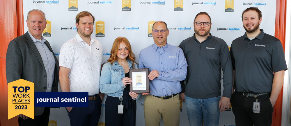 HBS staff accepting Top Workplace 2023 Journal Sentinel award