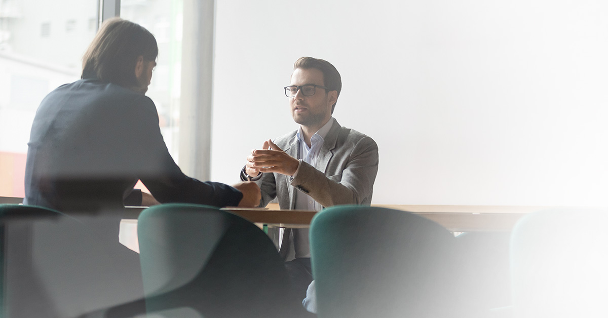 Employees having discussion at a table