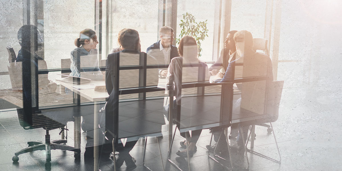 Employees at Conference Table Conducting Tabletop Exercise Employees at Conference Table Conducting Tabletop Exercise