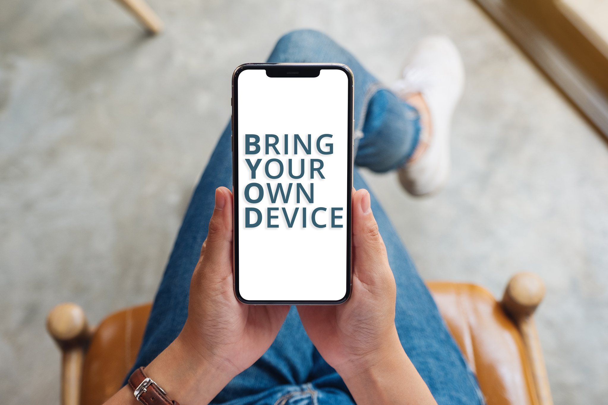 Top view mockup image of a woman holding mobile phone with blank white screen