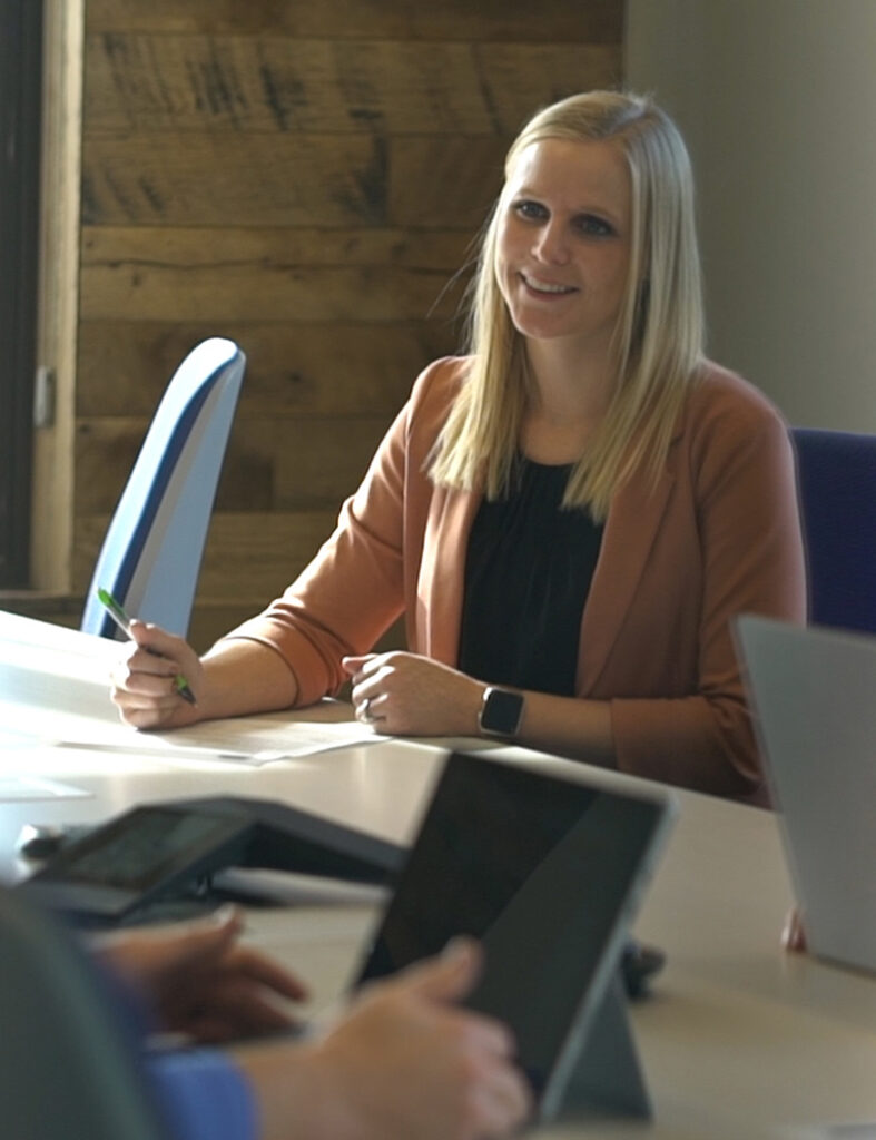 Virtual CISO Meeting in Office - Female Taking Notes in Technology Office Setting