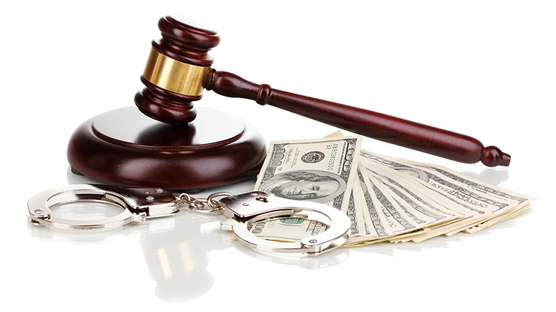 Image symbolizing legal consequences of failing to follow SEC cybersecurity guidance, featuring a wooden judge's gavel and sound block, handcuffs, and a stack of US dollar bills. This represents the enforcement of financial regulations and potential legal and financial penalties for non-compliance with security measures required by the Securities and Exchange Commission to protect market integrity and investor data.