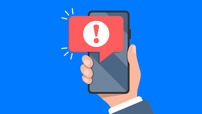 An illustration of a hand holding a mobile device with a red alert symbol, indicating the possibility of ACH fraud. An illustration of a hand holding a mobile device with a red alert symbol, indicating the possibility of ACH fraud.