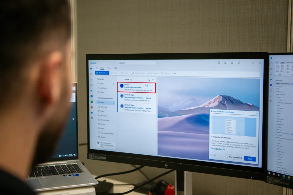 Employee viewing Outlook inbox Employee viewing Outlook inbox