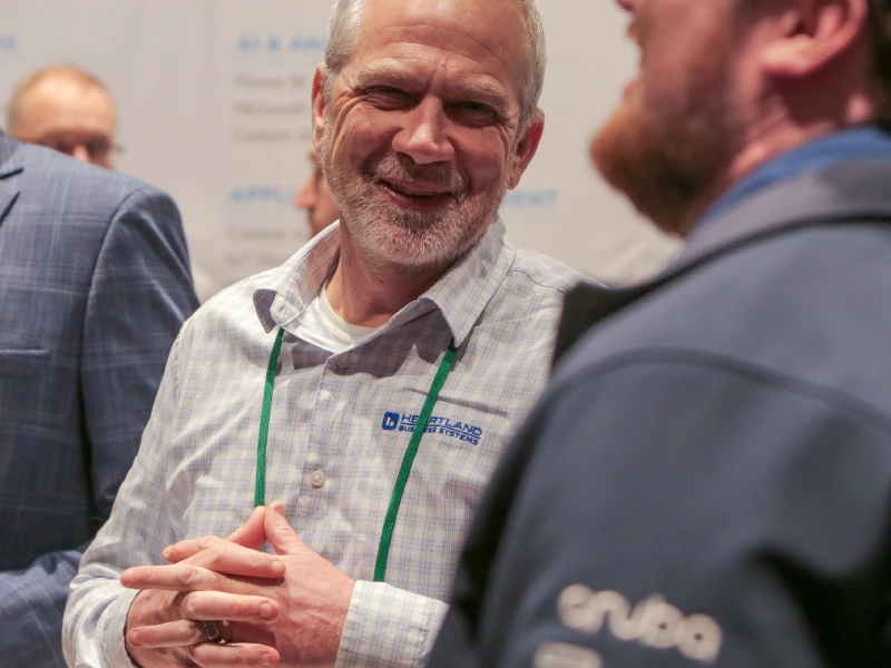 Man in HBS shirt smiling.