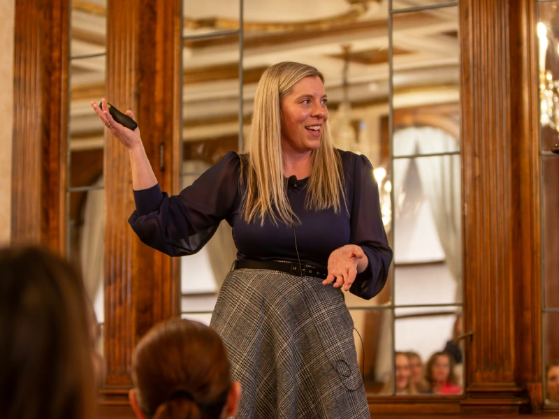 Kelly Grosskreutz of HBS presents in front of an audience.