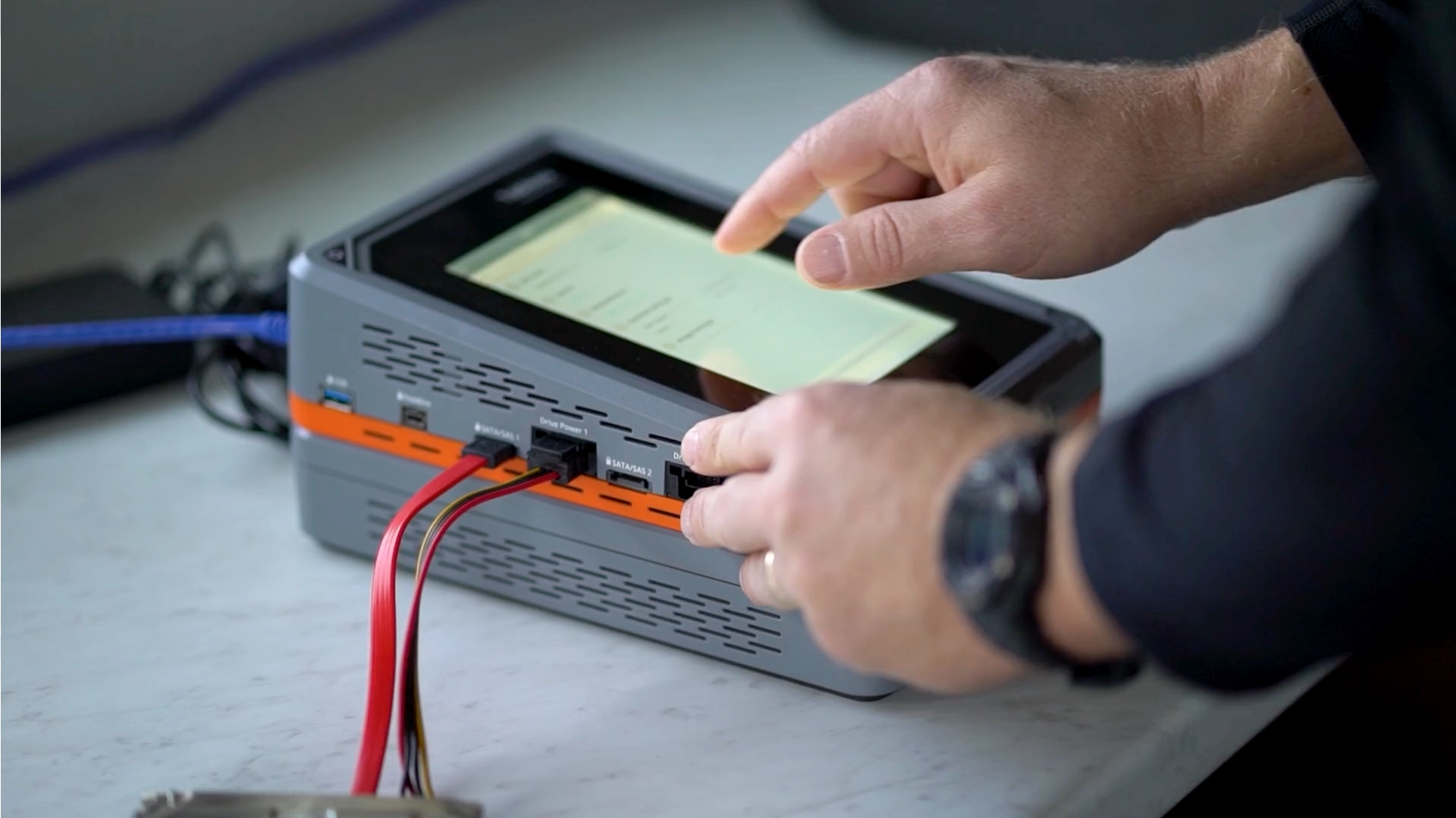 Close up of hands using the touchscreen on a device