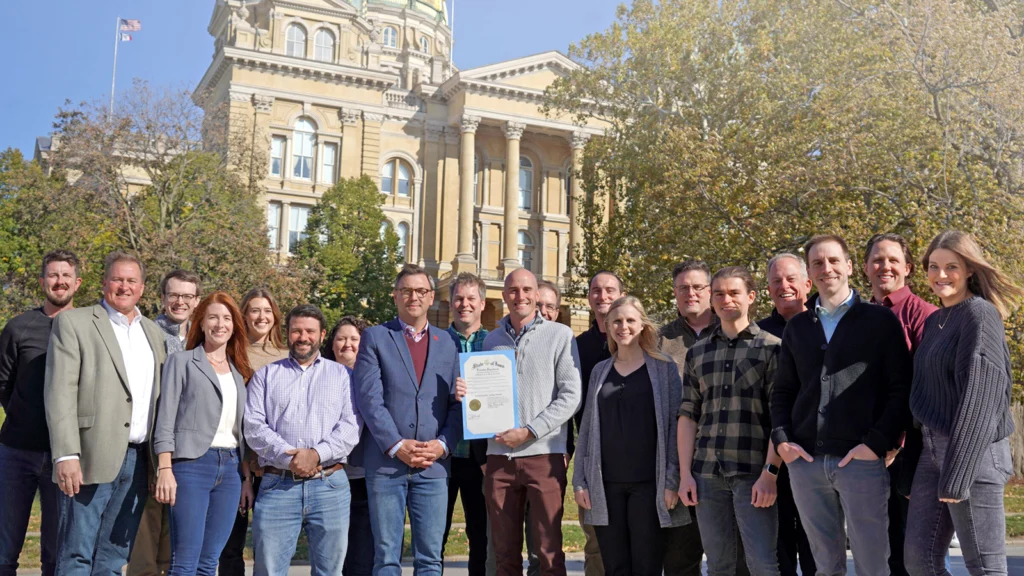 Photo of the HBS Iowa team in front of the state capitol building of Iowa in honor of the proclamation of Cybersecurity Action Month.
