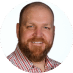 Round headshot photo of Sean G Palo wearing a red plaid button up shirt