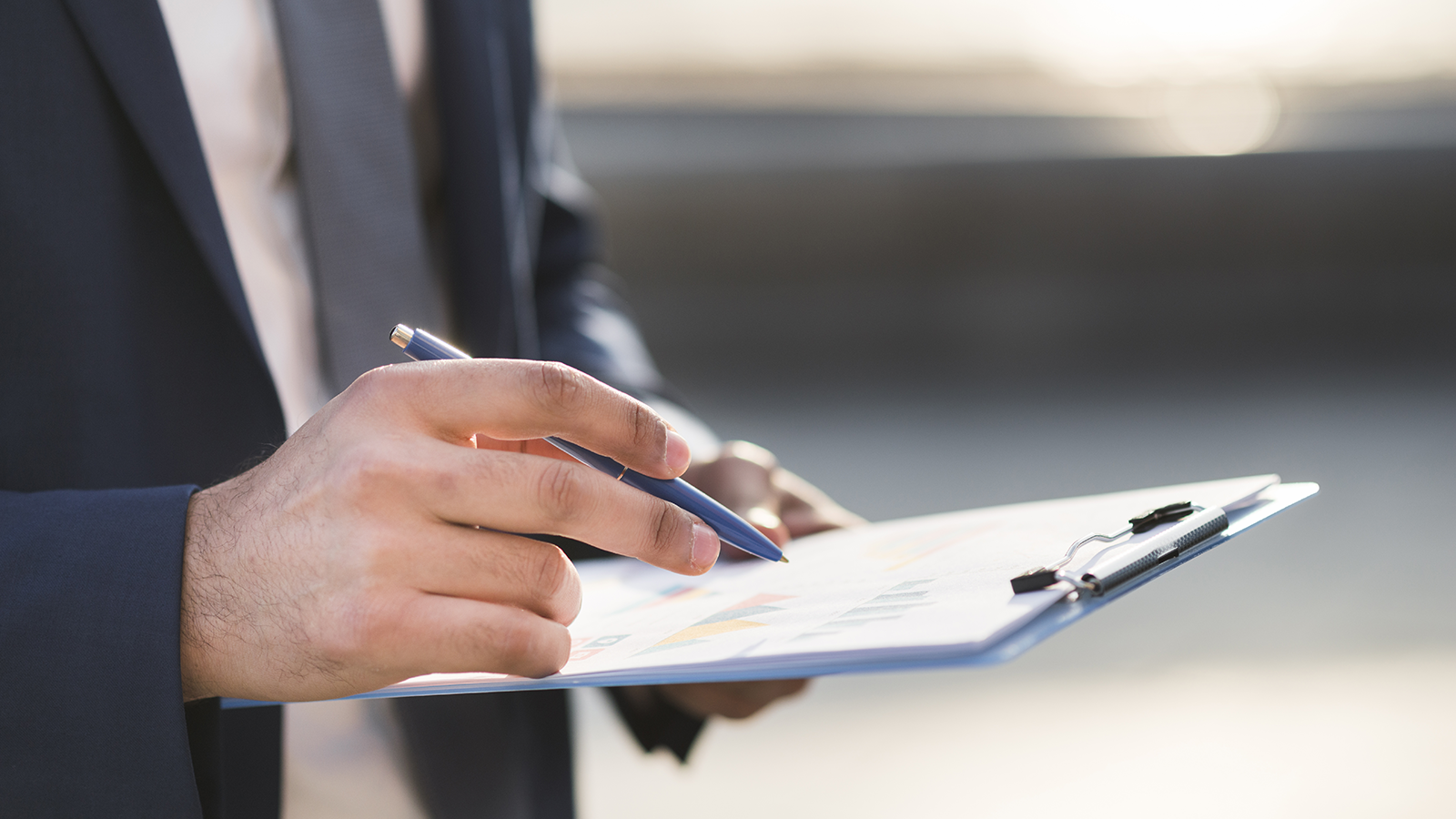 Business professional reviewing an AI liability insurance policy on a clipboard