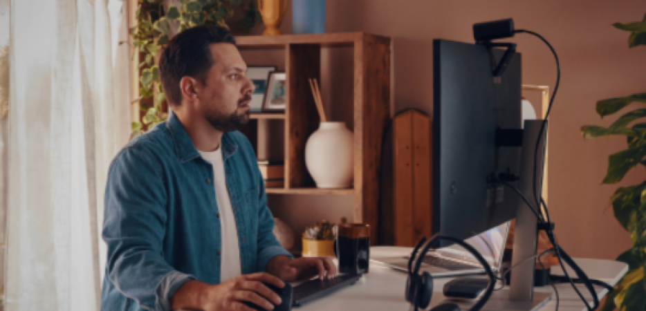 Man at an HP AI PC Desktop computer.