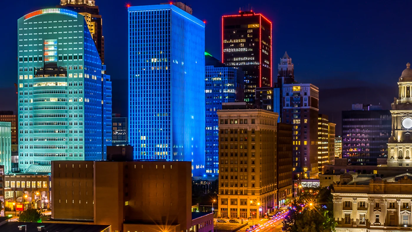 Des Moines at night buildingscape. Orange and blue lit office buildings against the night sky